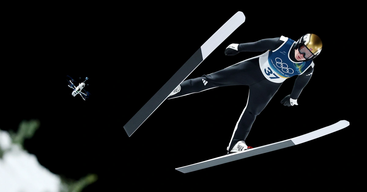 Drone flying behind skier in Cortina downhill